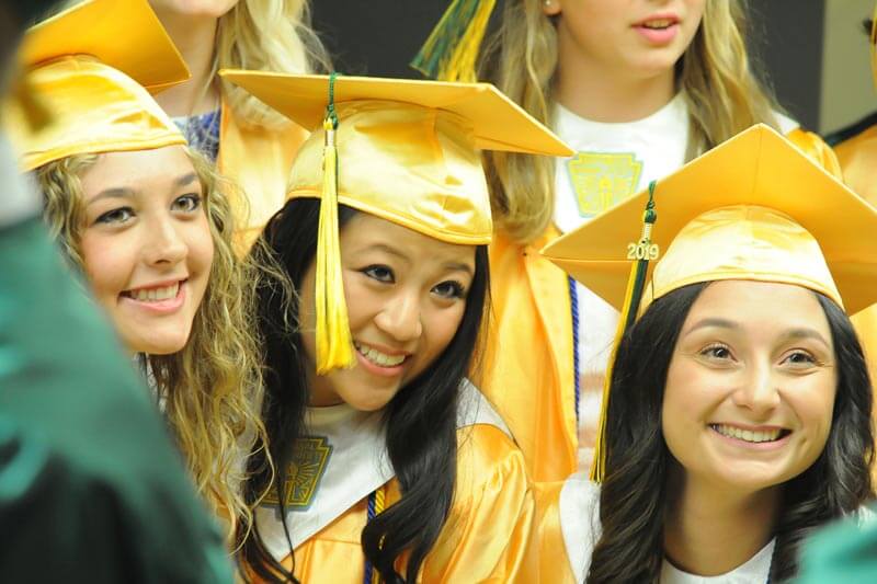 female graduates smiling