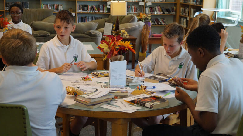 ms students around table with books