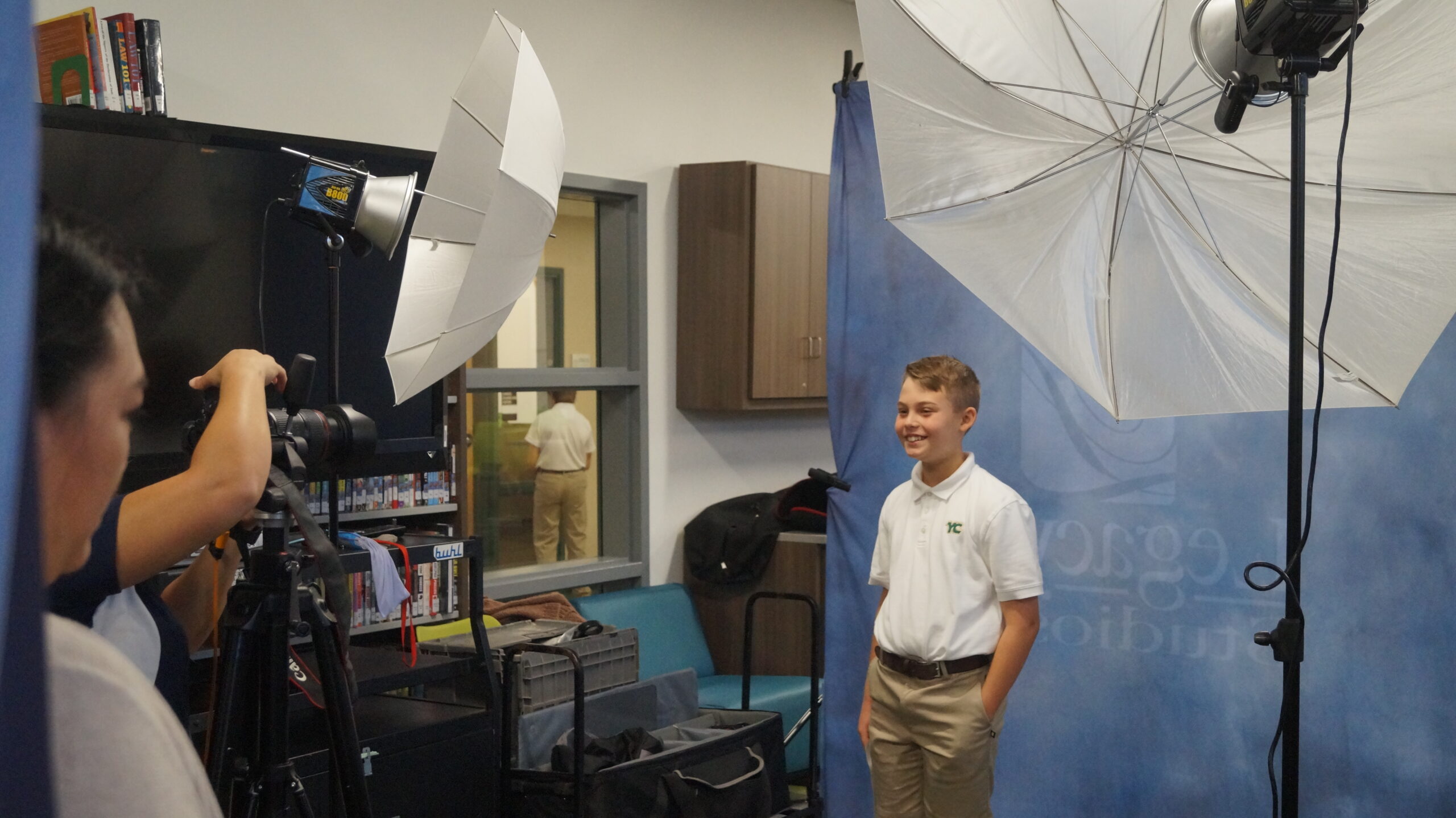 student getting professional photo taken