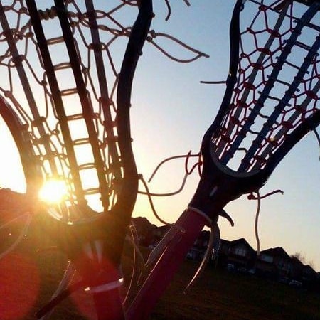 lacrosse-sticks-silhouetted-in-sunset