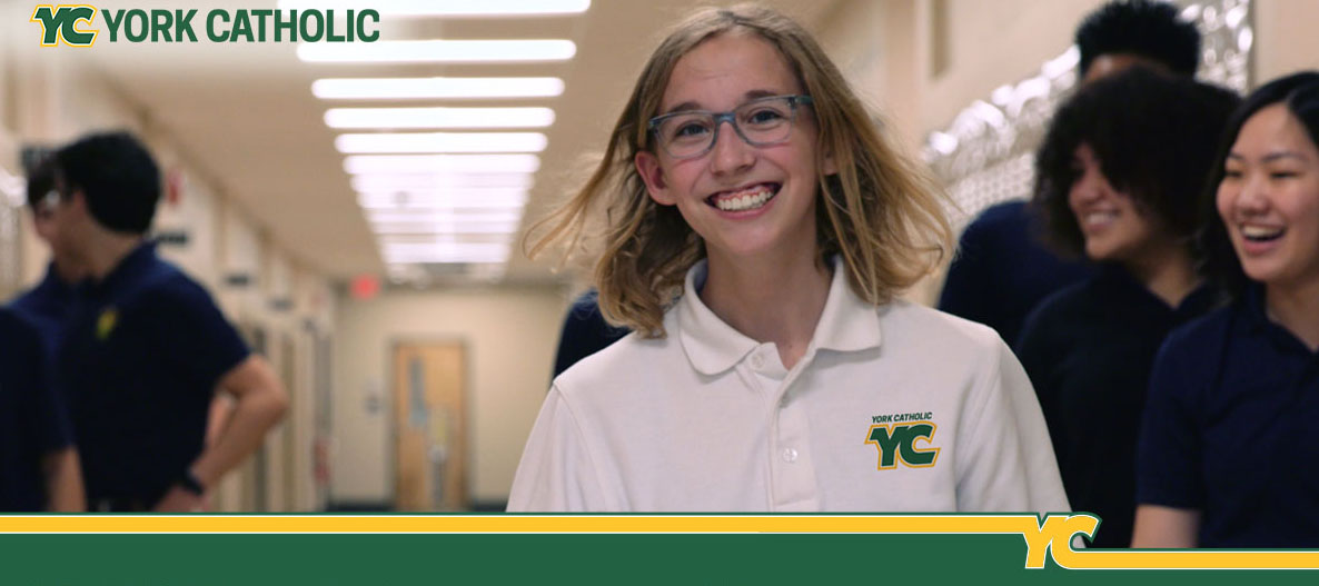 girl-in-YC-uniform-walking-down-hall
