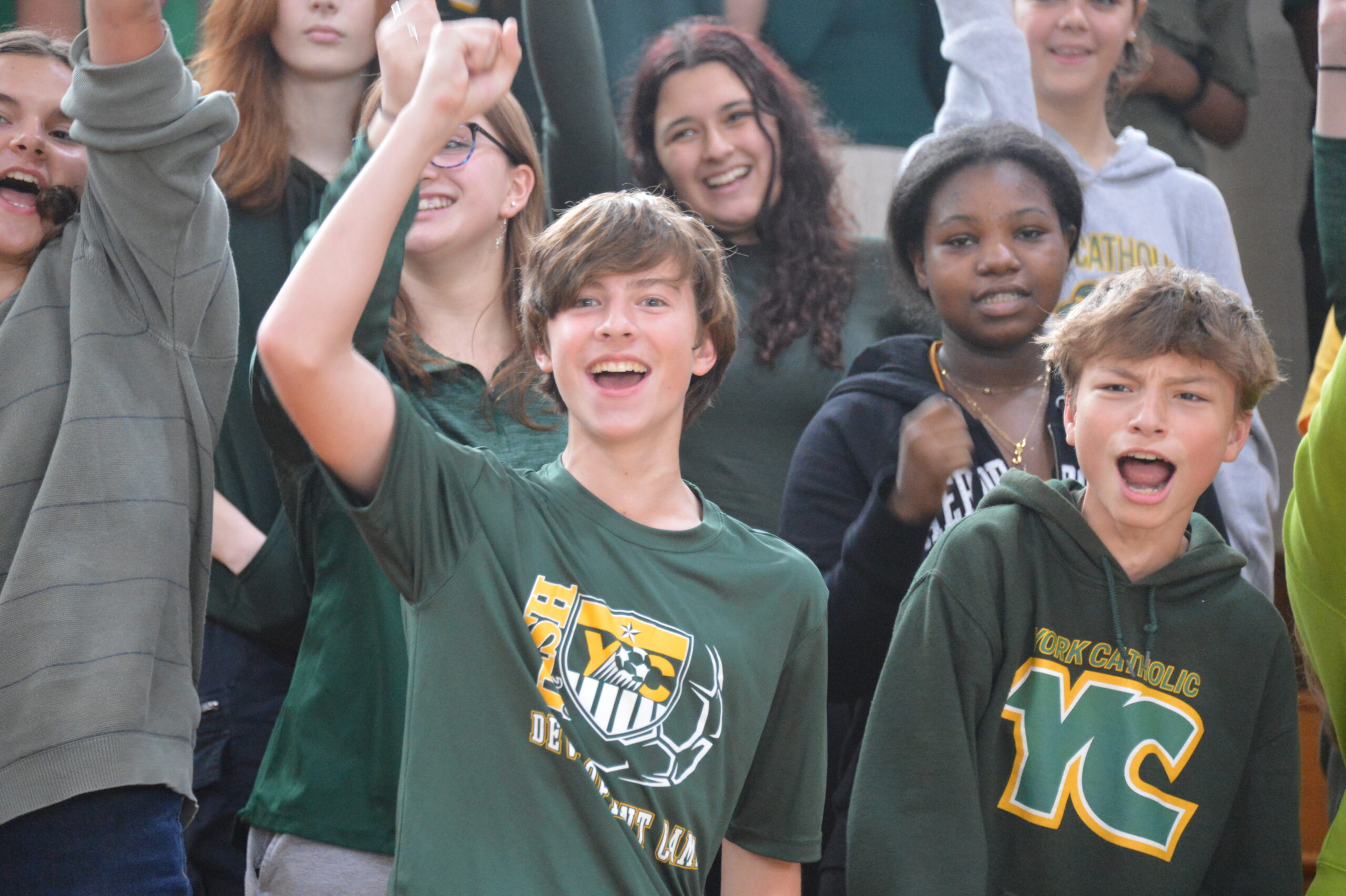 students in bleachers cheering