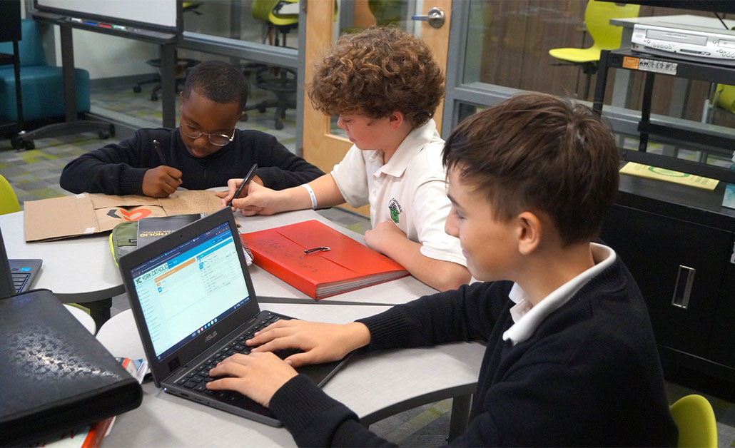 Student in classroom on laptop