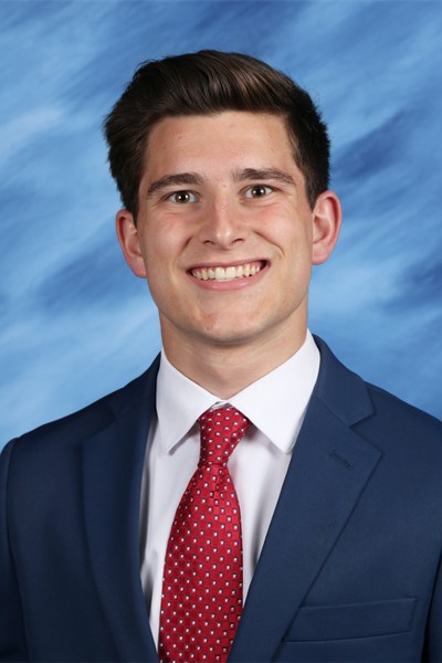 male student in suit and tie