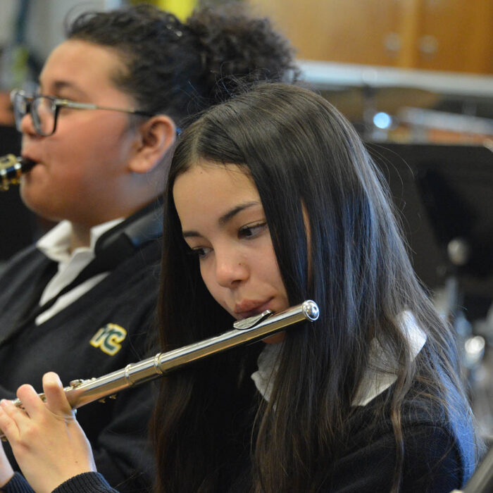 female YC students playing flute and saxophone